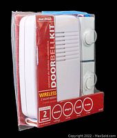 Photo of new open box Heath-Zenith wireless doorbell kit in original packaging including receiver and two doorbell buttons