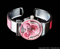 Single new XinHua Mickey Mouse watch with pink hinged cuff band shown from an angle, highlighting the rhinestone detailed face and unique open hinge band.