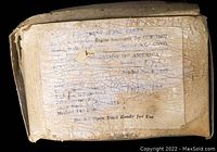 Photo of a worn and cracked label on a cardboard box for Engine Generator Set CCW-73037 from Lauson of America, indicating new old stock sealed parts.