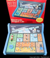 Photo showing the baseboard of the 30 in 1 Electronic Projects Lab with all electronic components and labels clearly visible.