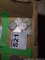 Six Newfoundland 1909 50 cent coins in a box