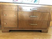 Front view of the buffet showing drawer arrangement and visible missing drawer pull.
