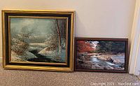 Both framed landscape paintings displayed side by side, showing size and framing details.