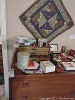 Overall view of wooden surface with trinket boxes, bracelets, necklaces and other costume jewelry