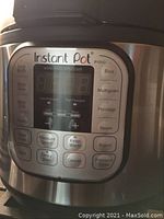 Close-up of Instant Pot Duo digital control panel with multiple cooking options