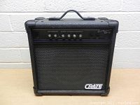 Front view of black Crate GX-15 guitar amplifier showing control panel and Crate logo on speaker grille.