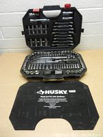 Open tool box showing the socket set, wrenches, ratchets, hex keys, and socket accessories organized inside the case.