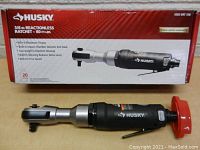Boxed Husky 3/8 in reactionless ratchet wrench showing front view with product details.