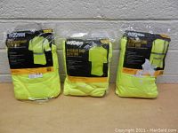 Three packaged bright yellow hi-visibility work shirts, two long sleeve with reflective stripes, one short sleeve plain, size 2XL.