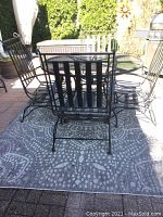 Full view of the patio set with table, chairs, and outdoor rug