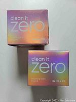 Two new sealed boxes of Banila Co Clean It Zero Cleansing Balm Original with iridescent packaging.