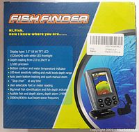Box of Fish Finder device showing specs and features including 3.5 inch 18bit TFT LCD, depth reading 2 to 240 ft, dual beam sonar frequency, fish identification, and water temperature indicator.