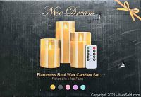 Box for flameless real wax candles set with 3 candles and a remote control shown on the front. Shows brand Nice Dream and mentions flicker like a real flame.