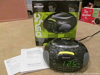 Sony Dream Machine with original packaging and manuals in background.