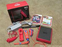 Nintendo Wii Mini console and all related accessories including controllers, cables, and games arranged on a carpeted surface.