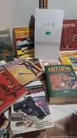 Photo showing the lot with multiple books related to firearms, guns, ammunition, and shooting.