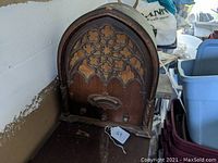 Front view of vintage Echophone cathedral radio showing the ornate Gothic-style front grille and overall wooden cabinet.