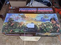 Top view of the boxed vintage Fortress America board game showing colorful front artwork and title.