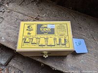 Closed wooden box with product label showing Viper carbide router bit set details including sizes and angles.