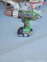 Side view of Hitachi 18 volt cordless drill with battery attached showing the drill chuck and body details