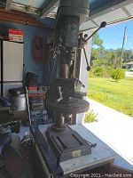 Remington Industrial drill press vertical view showing controls and pulley housing.