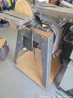 Front-left angle view showing overall unit on metal stand