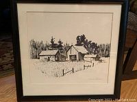 Full view of the framed pen and ink artwork showing rustic barns, fencing, and trees in background.