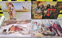 Photo showing four tin metal advertisement signs with vintage child, dog, farm, and horse illustrations.