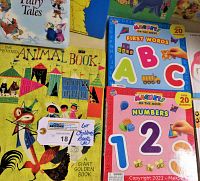 Front covers of children's books including The Provensean Animal Book, Magnet First Words and Numbers Books