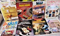 Nine handyman DIY how-to books including titles on basic wiring, decorating, painting, and home emergencies, arranged on a surface.
