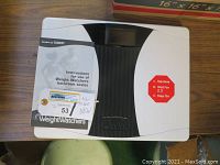 Top view of the Weight Watchers branded digital bath scale showing instruction stickers and branding.