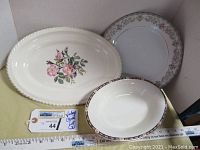 Three vintage serving dishes arranged showing full designs and size reference.