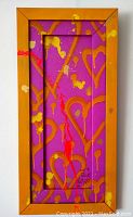 Front view of painting showing orange vintage wood frame, purple background with red, yellow and orange spray paint hearts and drips