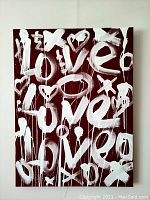 Front view of entire painted canvas showing repeated LOVE motif on red background