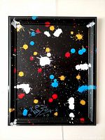 Full frontal view of 'Space #20210939' painting showing vibrant multicolor splatters on black background in vintage wood frame.