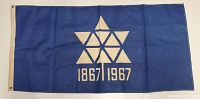 Blue flag with geometric yellow maple leaf and the years '1867 1967' printed below.