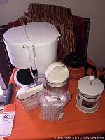 Overview of all kitchen items including coffee pot, French press, bagel cutter, and accessories.