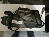 Top view of the Black and Decker belt sander showing the power unit, label with model details, and power cord coiled around it.