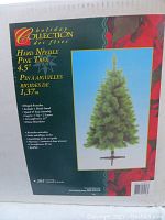 Box front showing product details for the Canadian Tire Holiday Collection Hard Needle Pine Tree, 4.5 feet tall.