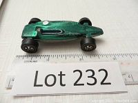 Side angle of vintage Hot Wheels Green Shelby Turbine car showing length and general condition with some paint wear.