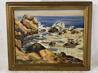 Frontal view of the painting showing the entire seascape scene within the gold-toned frame.