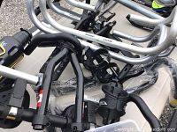 Overview of various aluminum handlebars and aero bars laid out on table