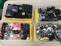 Four bins with assorted bike parts