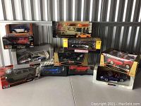 Overall grouping of eight packaged model cars on shelf