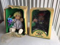 Two original Cabbage Patch Kids dolls in original boxes, one with box damage and one intact