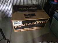 Closed cardboard box printed with PoulanPro branding