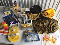 Full overview of triathlon accessory collection showing watches, hats, paddles, wristbands, clothing and caps.