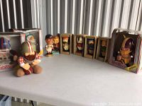 Front view: three NFL Huddles in boxes (Bills, Giants, Redskins) plus one loose 49ers figure