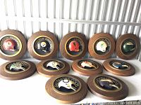 Ten plaques arranged in two rows, showing variety of teams.