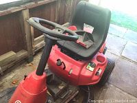 Front and operator area view showing steering wheel, seat and controls